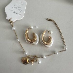 Gold and White Statement Earrings with Modern Design